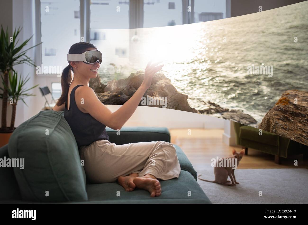 Lady In VR Headset Touching Screen Enjoying Augmented Video Indoors ...