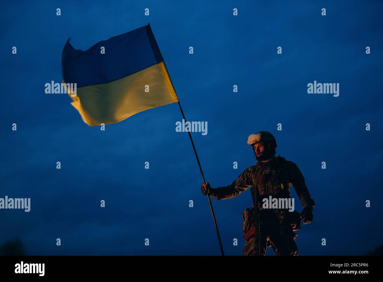 Ukrainian defender wath a national flag in the evening Stock Photo - Alamy