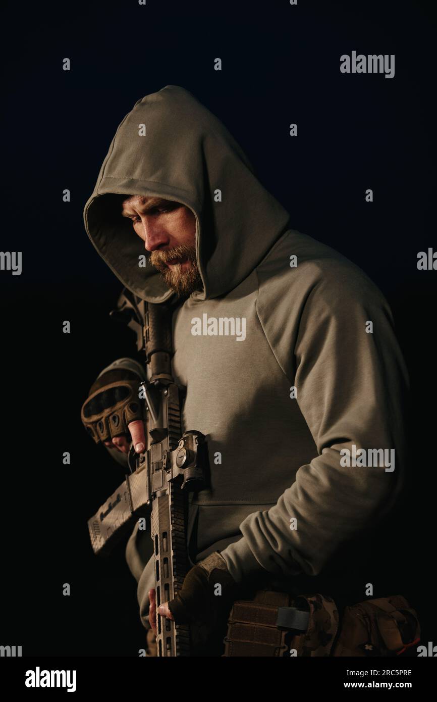 Ukrainian defender with his weapon on a black background Stock Photo ...