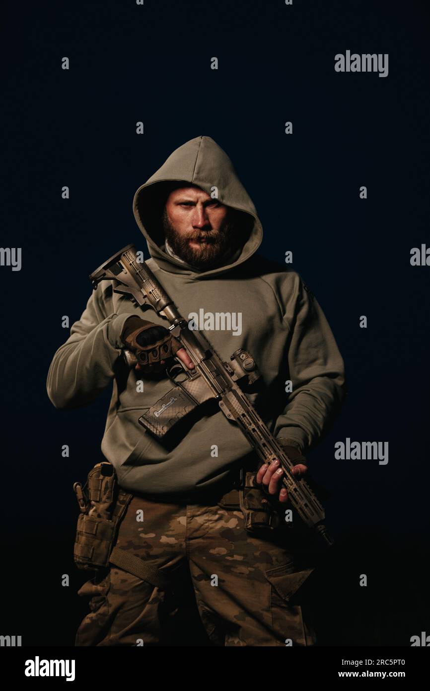 Portrait of Ukrainian defender holding rifle Stock Photo - Alamy