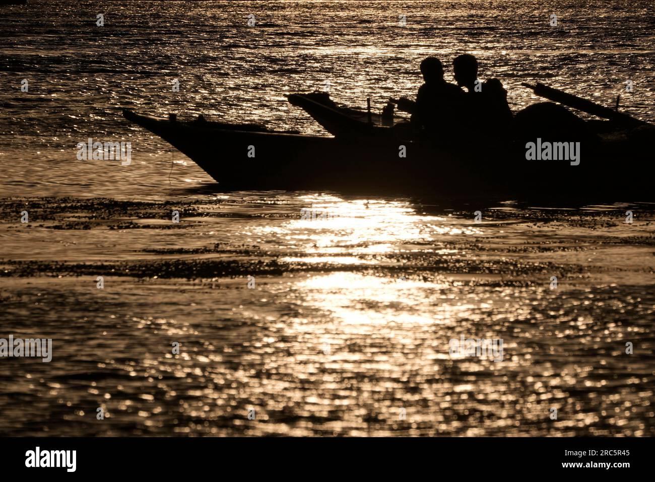 Egyptian fishermen cool themselves as they stay on their boat on the