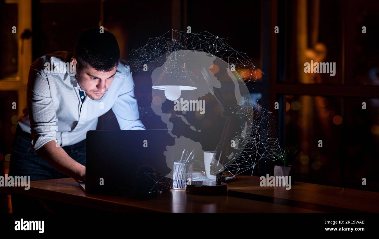 Young man entrepreneur working on laptop, using chatbot Stock Photo