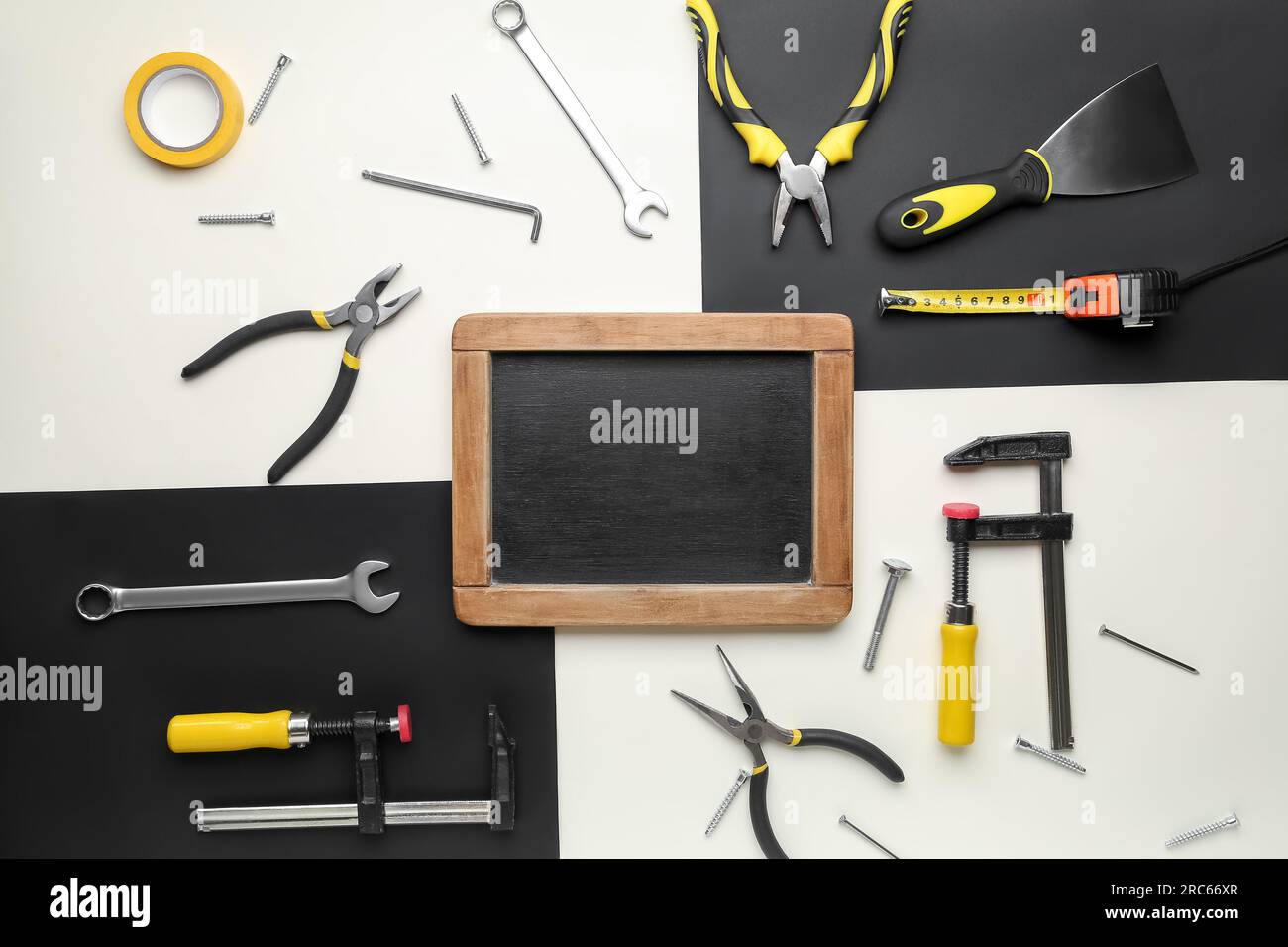 Chalkboard with different tools on black and white background. Labor Day celebration Stock Photo