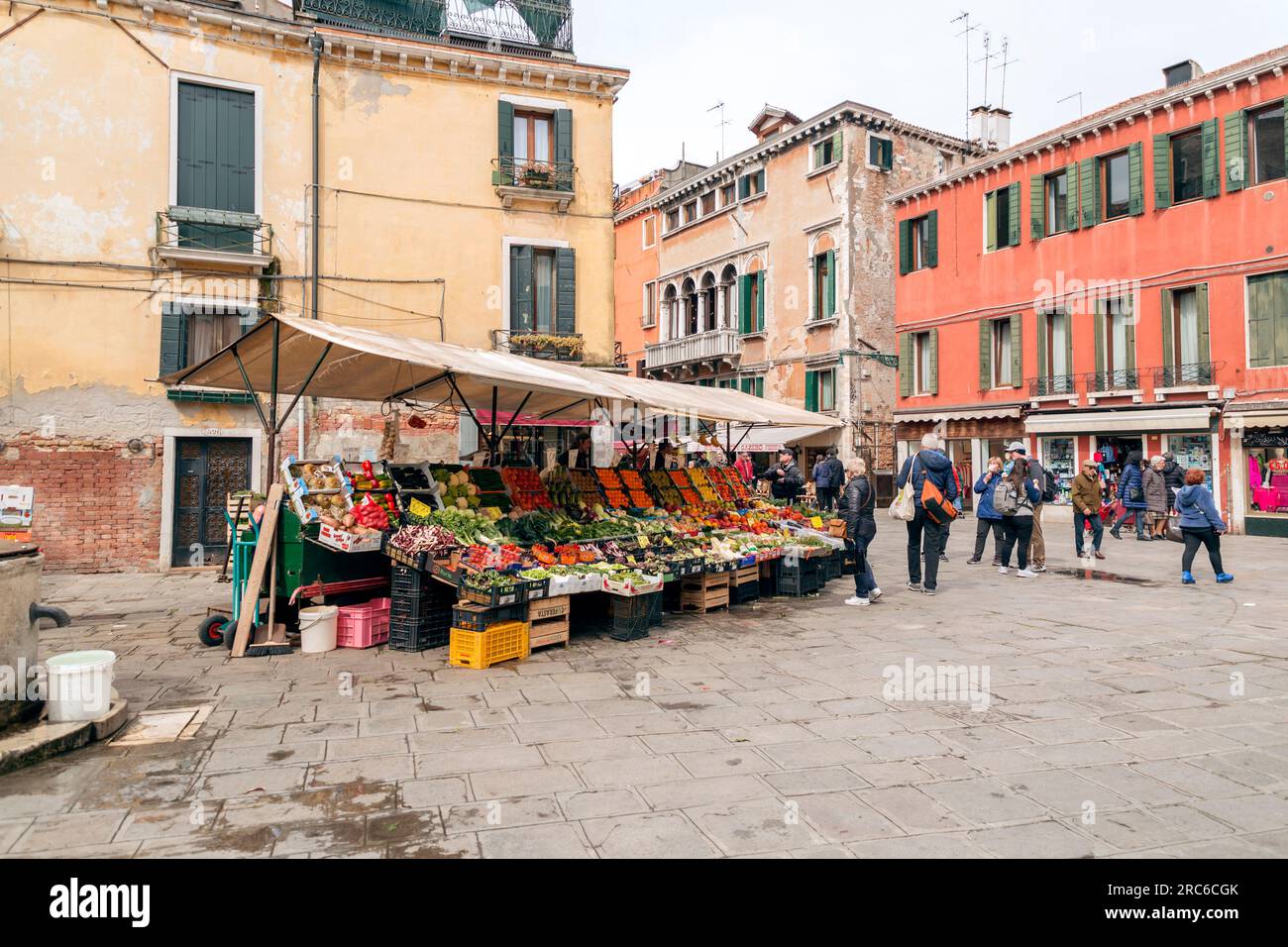 Venice, Italy April 2, 2022 People buying fresh fruits and
