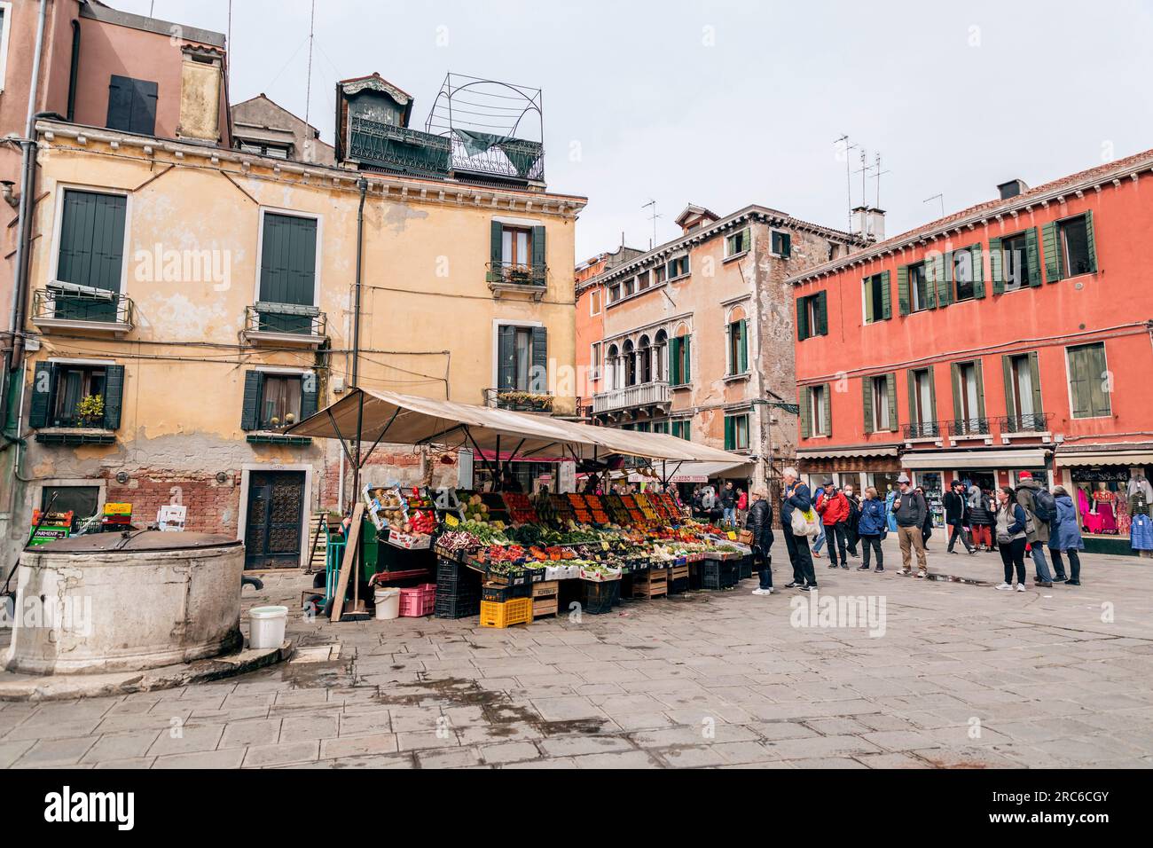Venice, Italy April 2, 2022 People buying fresh fruits and