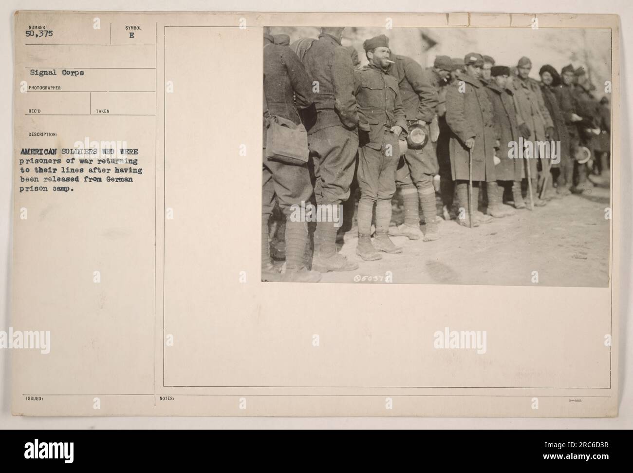 American soldiers who were prisoners of war returning to their lines after having been released from a German prison camp. Photo taken by the Signal Corps photographer SECO. The image is part of the collection issued with the symbol B and bears the notes 150375. Stock Photo