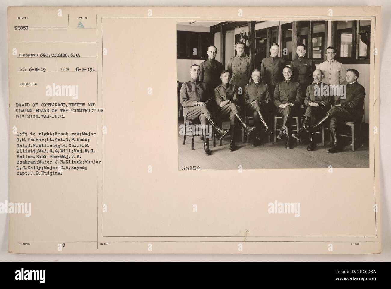 Board of Contract Review and Claims Board of the Construction Division, Wash. D.C, in a meeting on June 2, 1919. The image shows members of the board, including Major C.M. Foster, Lt. Col. O.F. Noss, Col. J.N. Willout, Lt. Col. E.B. Elliott, Maj. G.G. Will, Maj. P.G. Bollos in the front row. In the back row are Maj. V.W. Coahran, Major J.H. Klinck, Major L.G. Kelly, Major C.S. Hayes, and Capt. J.B. Hudgins. Stock Photo