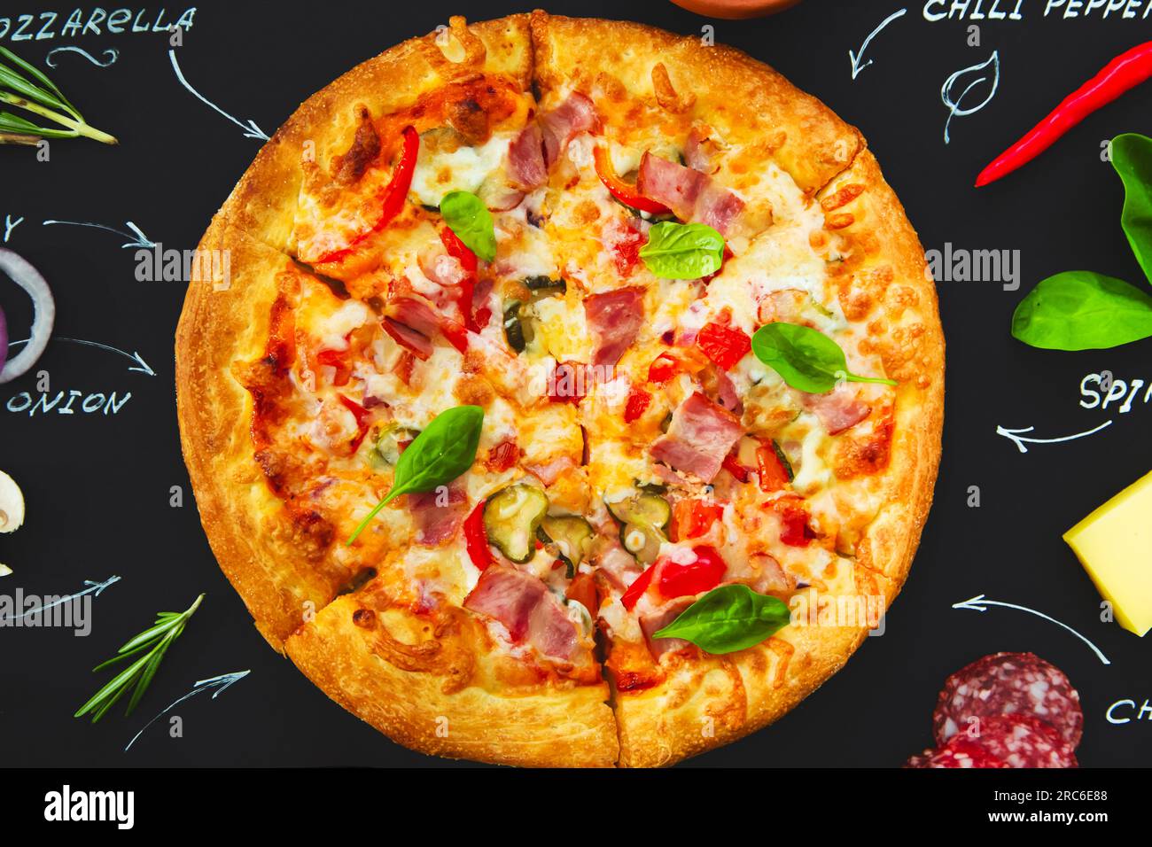 Pizza, ingredients and product names written in chalk on a black