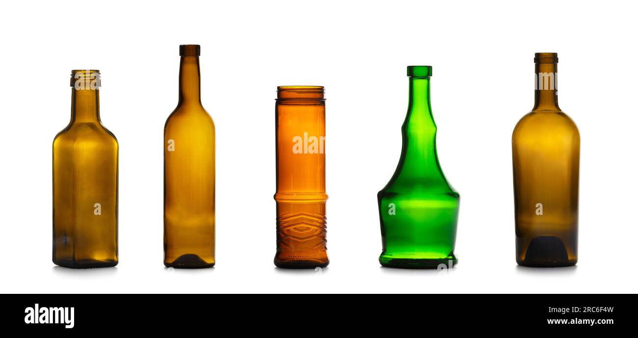A set of empty glass bottles of different colors and shapes for