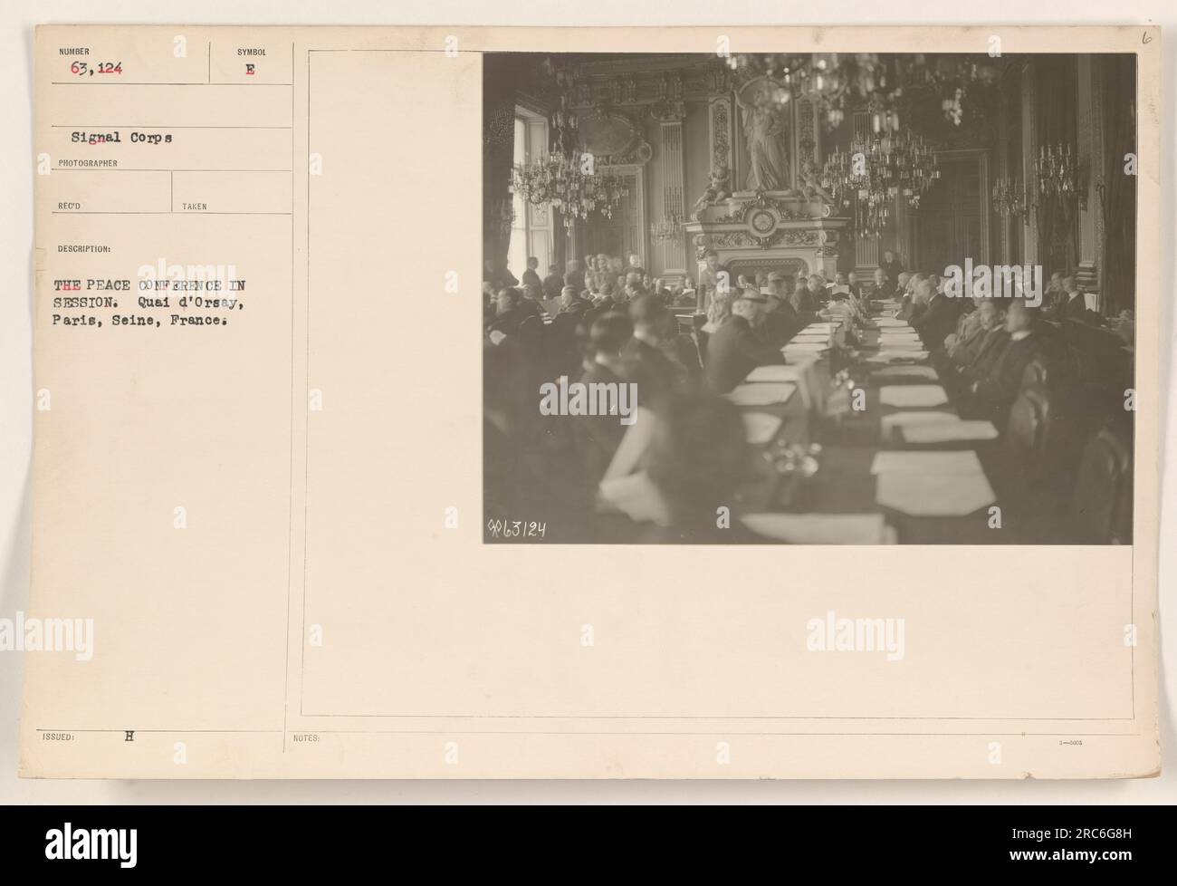 Delegates from various countries at the Peace Conference in session at the Quai d'Orsay in Paris, France. This photograph, taken by a signal corps photographer, captures the diplomatic discussions aimed at negotiating and establishing peace after World War One. Image NU 63, 124. Notes indicate the unique identifier and additional details. Stock Photo