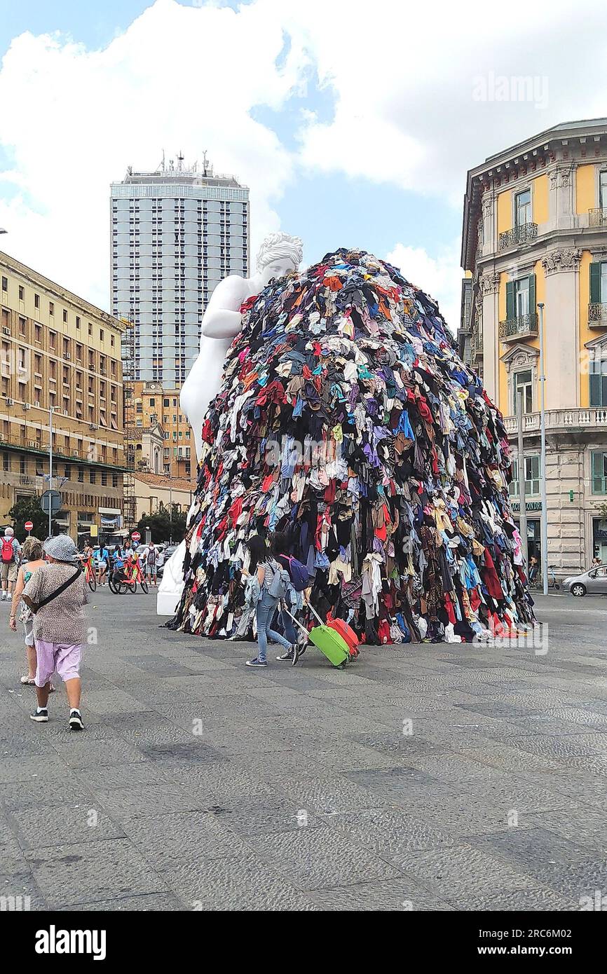 Naples, 12/07/2023, On the night between Tuesday and Wednesday, a fire destroyed the art installation Venus of Rags, by Michelangelo Pistoletto, which from June 28 was exposed in Piazza Municipio, in the center of Naples. The installation is one of the most famous works of Pistoletto, one of the most famous contemporary Italian artists of the current 'arte povera'. The burning installation was about 10 meters high and, in addition to the statue of Venus made of plaster and resin, consisted of a metal scaffold covered with rags. The images date back to a few days before the fire and show crowds Stock Photo