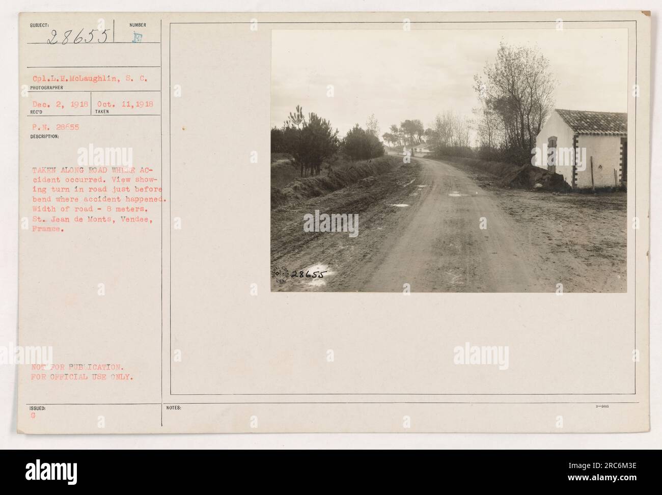 Cpl. L.H. McLaughlin of the S.C. is shown in this photograph taken by SUNDER on Dec. 2, 1918. The image captures a bend in the road where an accident occurred during World War One. The road is approximately 8 meters wide and is located in St. Jean de Monts, Vendee. The photograph is marked not for publication and is intended for official use only. Stock Photo