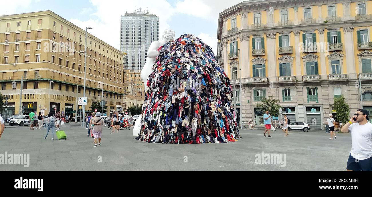 July 12, 2023, Naples, Campania, Italy: On the night between Tuesday and Wednesday, a fire destroyed the art installation Venus of Rags, by Michelangelo Pistoletto, which from June 28 was exposed in Piazza Municipio, in the center of Naples. The installation is one of the most famous works of Pistoletto, one of the most famous contemporary Italian artists of the current ''arte povera''. The burning installation was about 10 meters high and, in addition to the statue of Venus made of plaster and resin, consisted of a metal scaffold covered with rags. The images date back to a few days before th Stock Photo