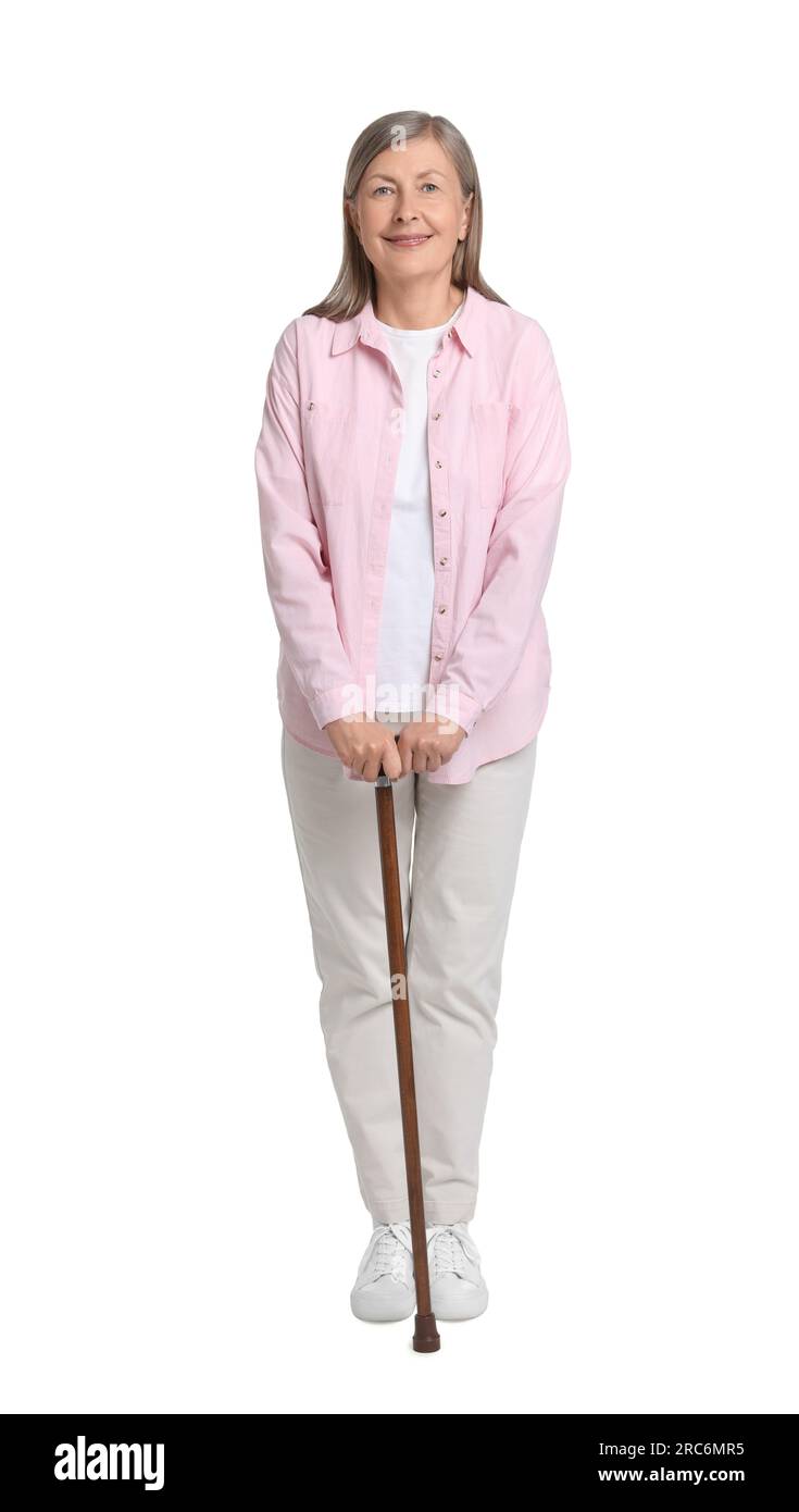 Senior woman with walking cane on white background Stock Photo - Alamy