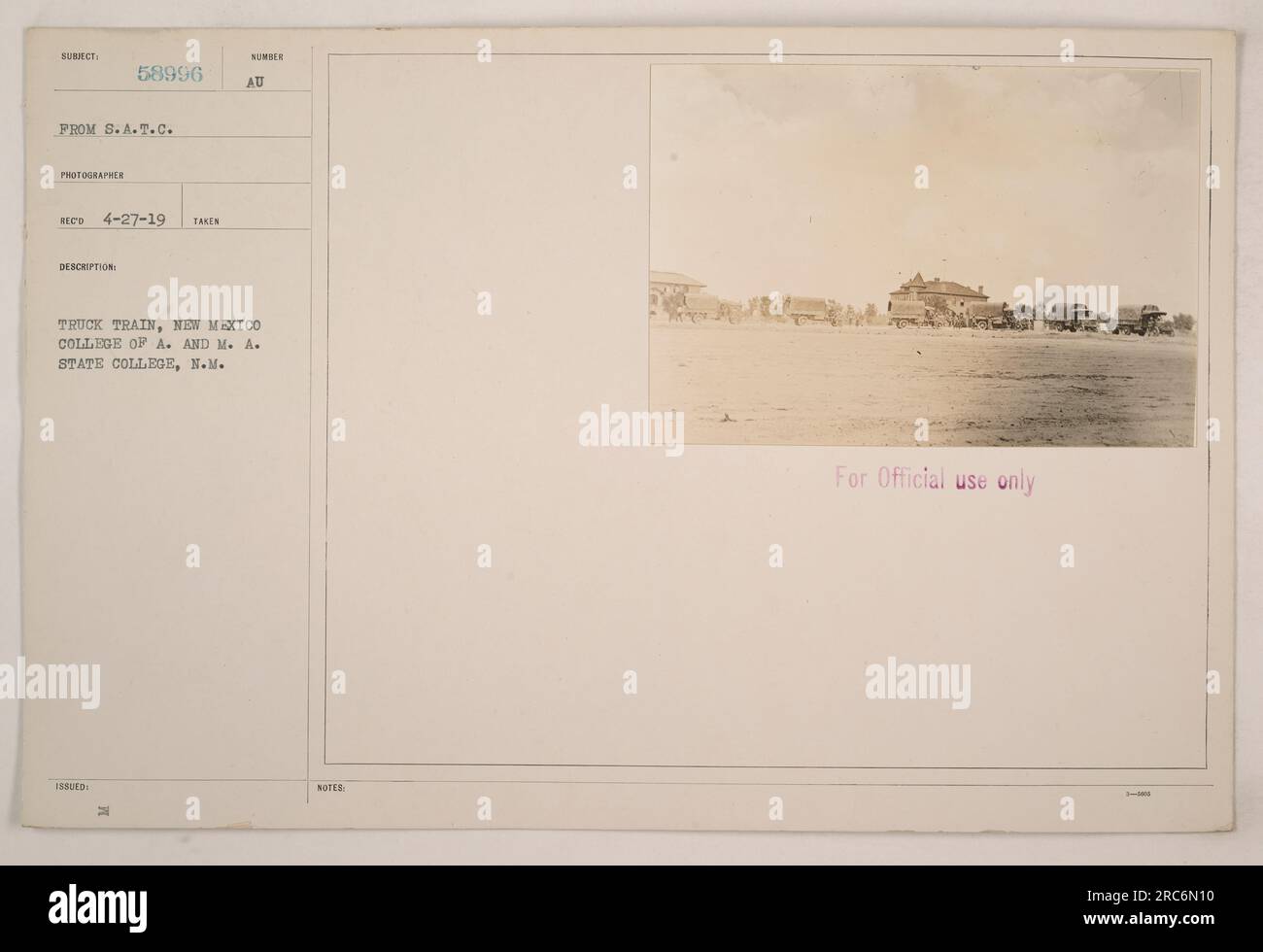 A truck train on the premises of the New Mexico College of Agriculture