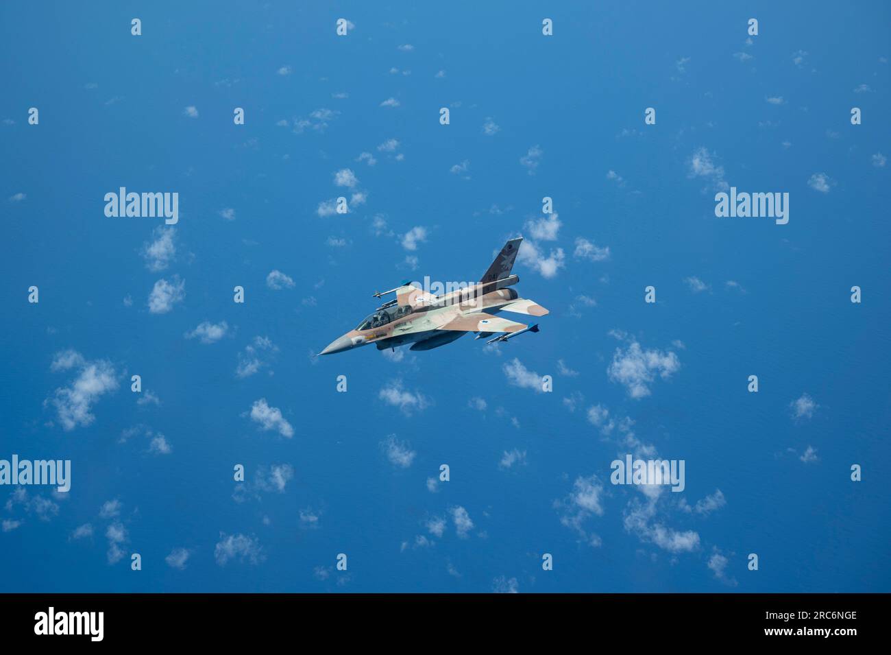 An Israeli Air Force F-16 flies after in-flight refueling operations with a U.S. Air Force KC-10 Extender during exercise Juniper Oak 23.3 above the U.S. Central Command area of responsibility, July 11, 2023. The U.S. is committed to its partnership with Israel while developing and maintaining interoperability with its partners, and ensuring regional security by providing essential training to deter adversaries from taking aggressive actions or malign activities against the U.S., coalition and partners. (U.S. Air Force photo by Senior Airman Jacob Cabanero) Stock Photo