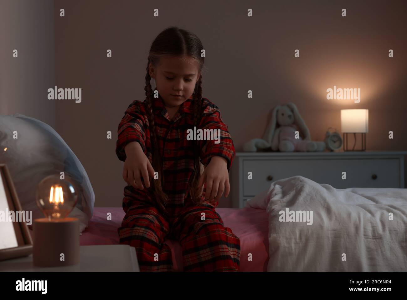 Girl in pajamas sleepwalking indoors at night Stock Photo Alamy