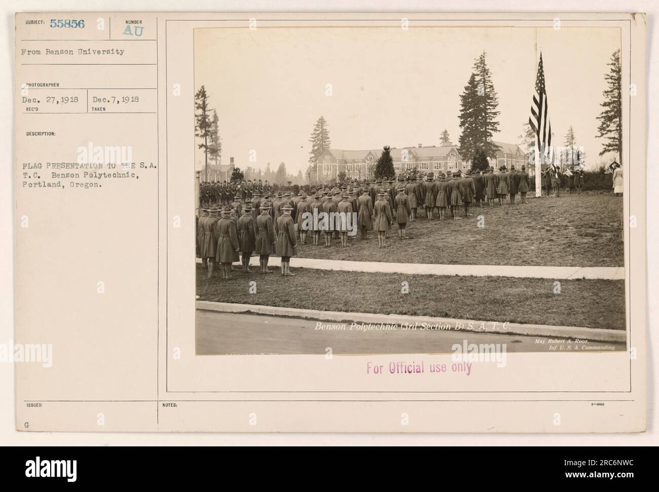 Group of soldiers and faculty members at Benson Polytechnic in Portland, Oregon, during World War I. They are gathered for a flag presentation to the S.A.T.C. (Student Army Training Corps). The photograph was taken on December 7, 1918. Maj. Robert, U.S. Army Infantry, oversaw the event. Stock Photo