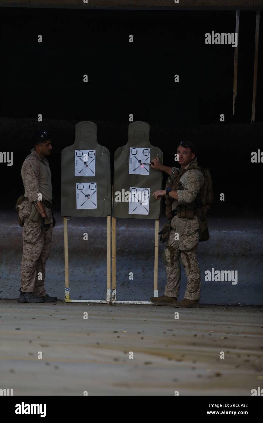 U.S. Marines Cpl. Coleman Grubbs and Cpl. Juan Gonzales with the 24th Marine Expeditionary Unit  reenlist in the Marine Corps on Camp Lejeune N.C. July 7, 2023. Marines with the 24th MEU maintain maritime excellence by the investment of further education and valuable training. (U.S. Marine Corps photo by Lance Cpl. Victoria Hutt) Stock Photo