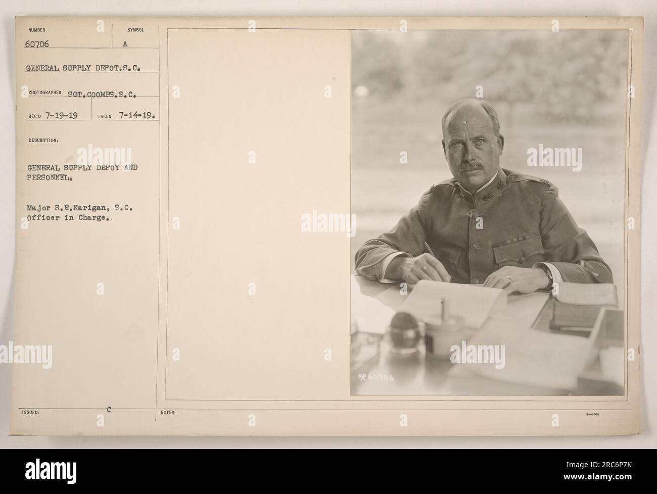 A photograph taken on July 14, 1919, depicts the General Supply Depot and personnel. Major S.E. Karigan, S.C., is shown as the officer in charge. The image was received on July 19, 1919, and was taken by Photographer S.C. Coomes. The symbol and description of the General Supply Depot are also included. Stock Photo