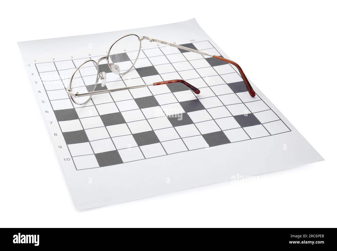 Blank crossword and eyeglasses on white background Stock Photo Alamy