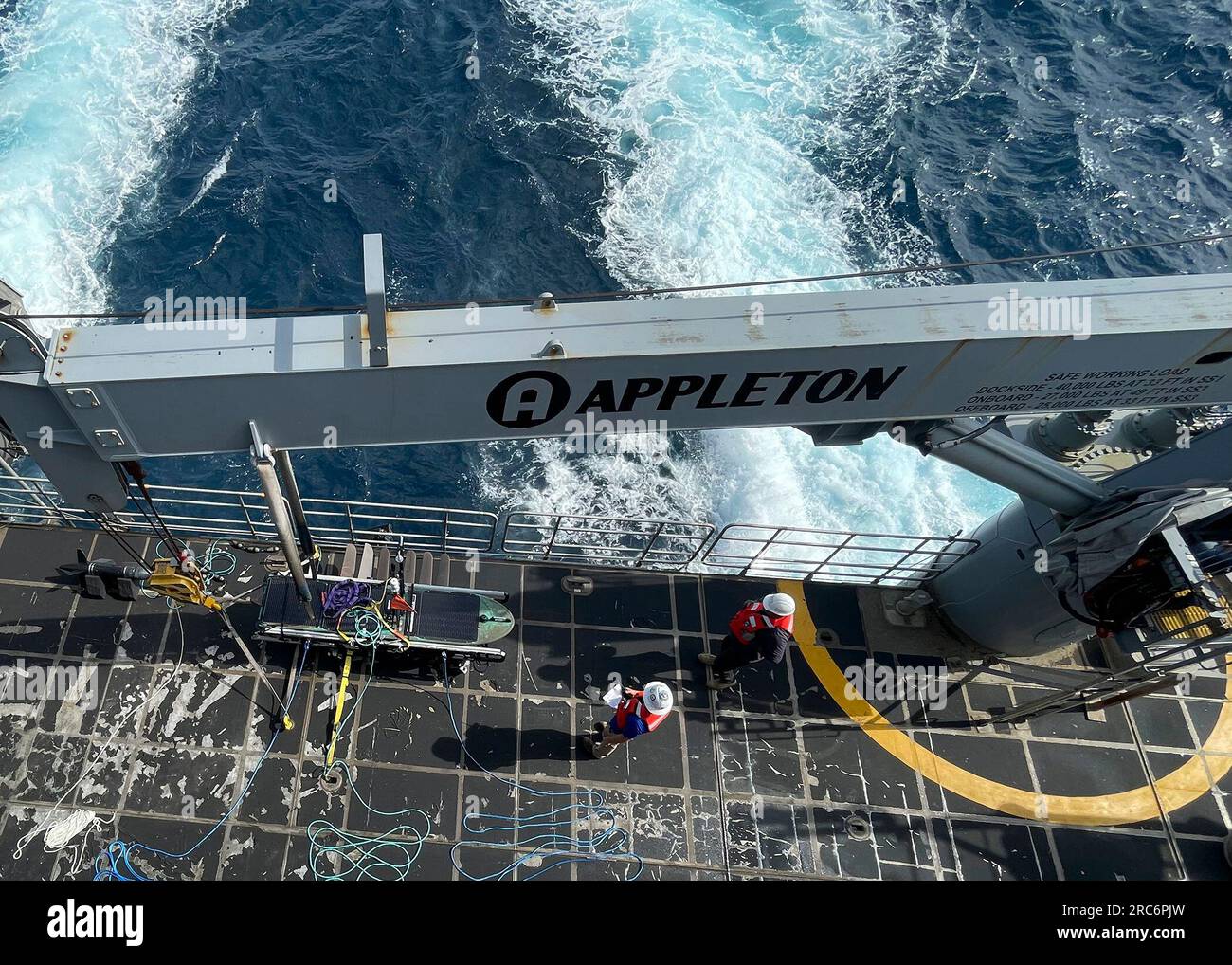 CARIBBEAN SEA (June 30, 2023) Sailors and civilian mariners launch a Wave Glider Unmanned Surface Vehicle from the fantail of expeditionary fast transport ship USNS Burlington (T-EPF 10) as a part of the UNITAS U.S. Naval Forces Southern Command/U.S. 4th Unmanned Integration Campaign. UNITAS is the world’s longest-running maritime exercise. Hosted this year by Colombia, it brings together multinational forces from 20 partner nations, including 26 warships/vessels, three submarines, 25 aircraft (fixed wing/helicopter) and approximately 7,000 people. The exercise trains forces in joint maritime Stock Photo