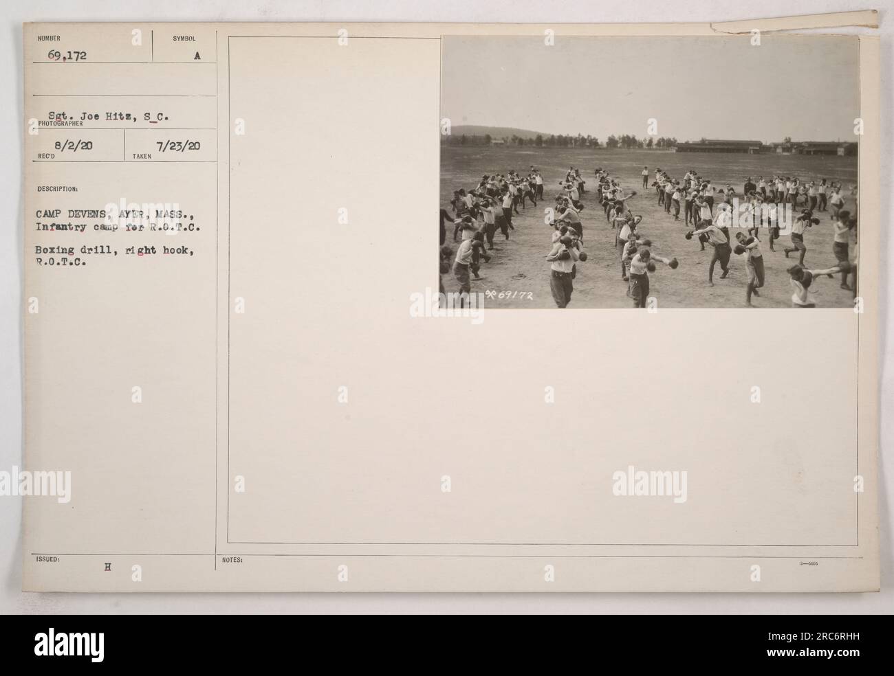 Soldier from the R.O.T.C at Camp Devens, Ayer, Massachusetts practicing a boxing drill, specifically the right hook. The soldier is identified as Sergeant Joe Hits and the photograph was taken on August 2, 1920. The photo was received, described, and issued with the symbol HAC. Stock Photo