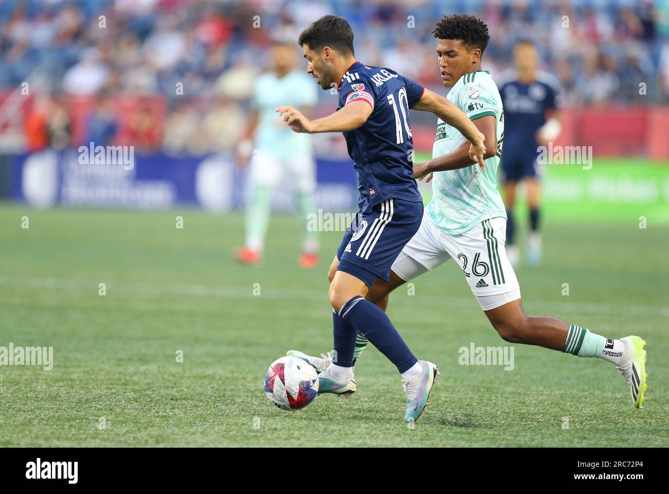 July 12, 2023; Foxborough, MA, USA; New England Revolution midfielder Carles Gil (10) and Atlanta United defender Caleb Wiley (26) in action during the MLS match between Atlanta United and New England Revolution. Anthony Nesmith/CSM Stock Photo