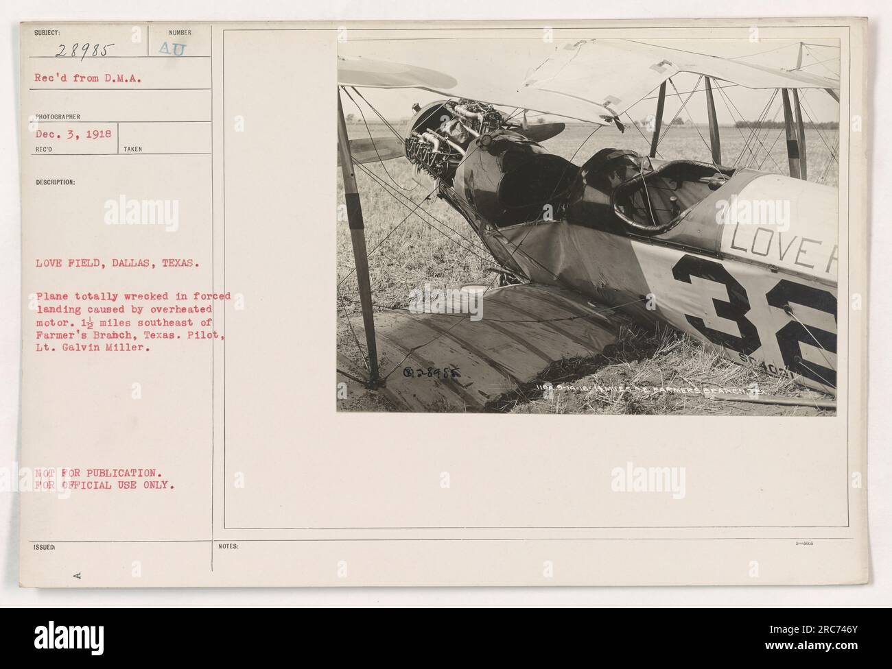 'The image shows a plane that has been entirely wrecked due to a forced landing caused by an overheated motor. The incident took place approximately 1 mile southeast of Farmer's Branch, Texas. The pilot involved was Lt. Galvin Miller. This photograph was taken at Love Field in Dallas, Texas.' Stock Photo