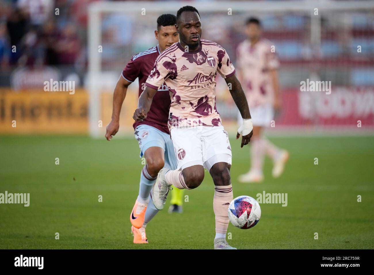 Portland Timbers forward Franck Boli, front, tracks down the ball as Colorado  Rapids midfielder Bryan Acosta pursues in the second half of an MLS soccer  match Wednesday, July 12, 2023, in Commerce