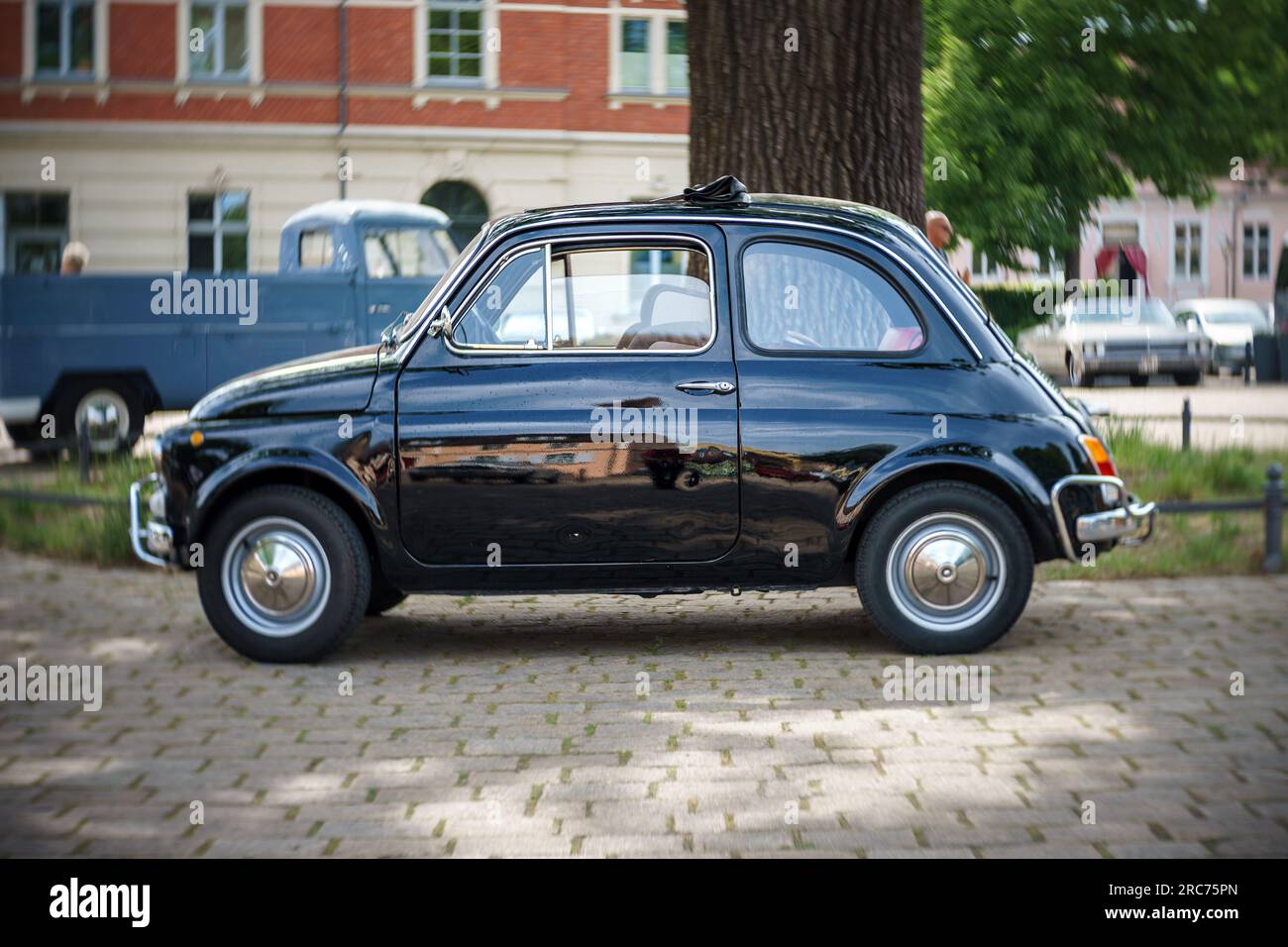 WERDER (HAVEL), GERMANY - MAY 20, 2023: The city car Fiat 500. Swirl bokeh, art lens. Oldtimer - Festival Werder Classics 2023 Stock Photo