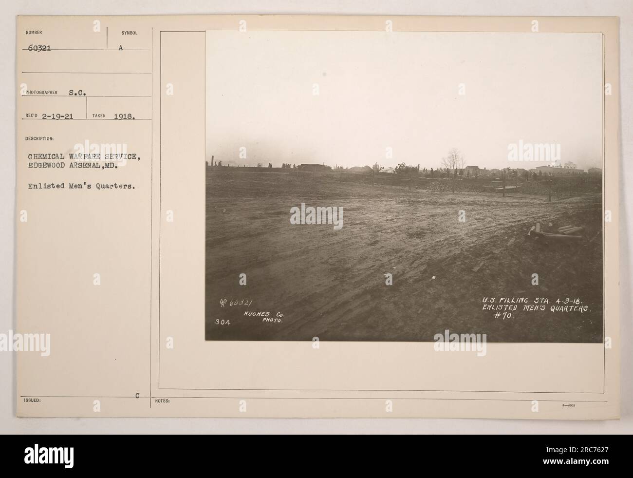 Enlisted Men's Quarters at Edgewood Arsenal, Maryland. This photograph, taken in 1918, shows the enlisted men's living quarters of the Chemical Warfare Service. The building is marked with the symbol of the Chemical Warfare Service. It is affiliated with the Hughes Company and serves as enlisted men's quarters number 10. Stock Photo