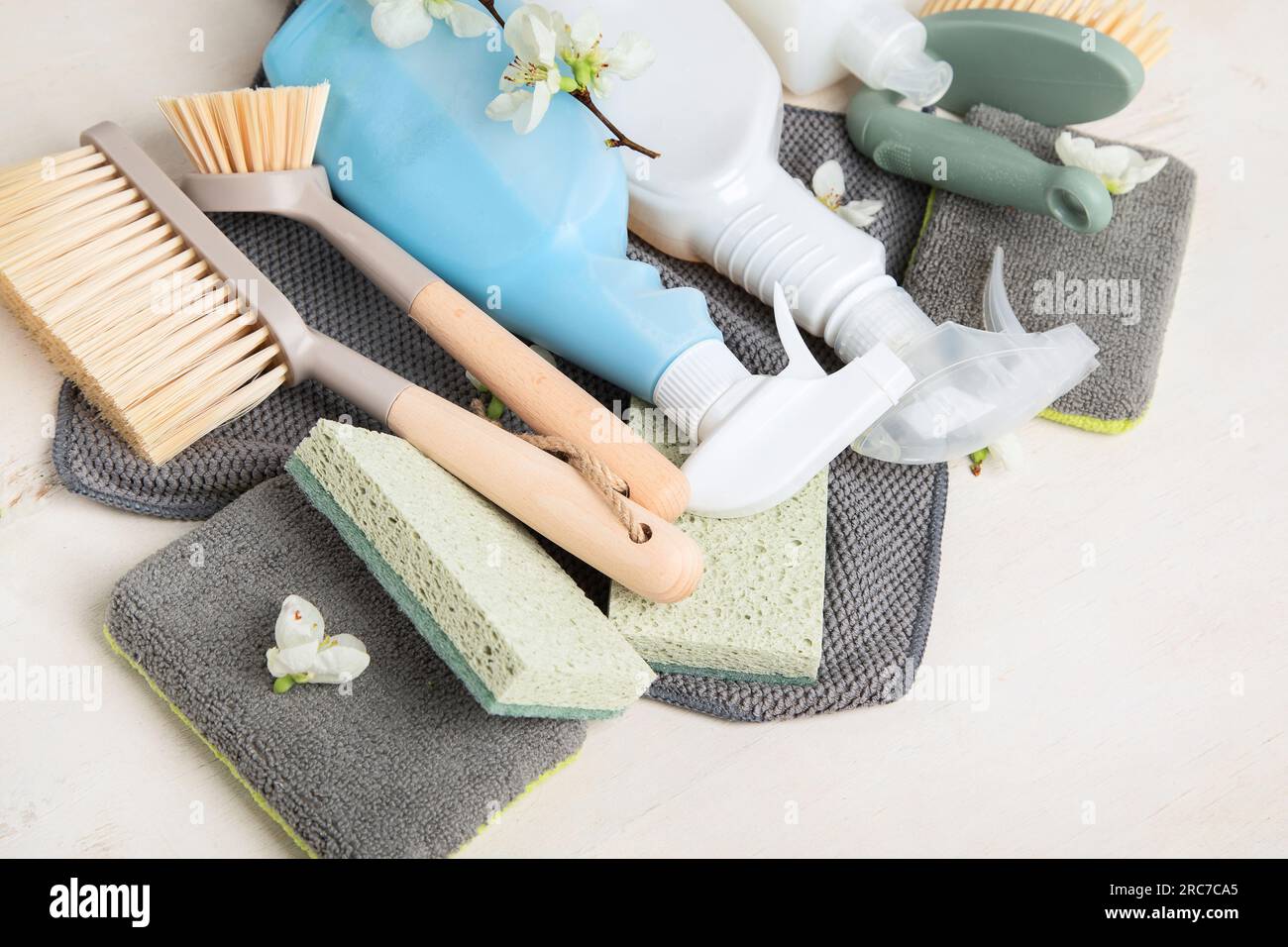 Brushes, sponges, rubber gloves and natural cleaning products. Eco-friendly cleaning products on a white background. Top view. Stock Photo