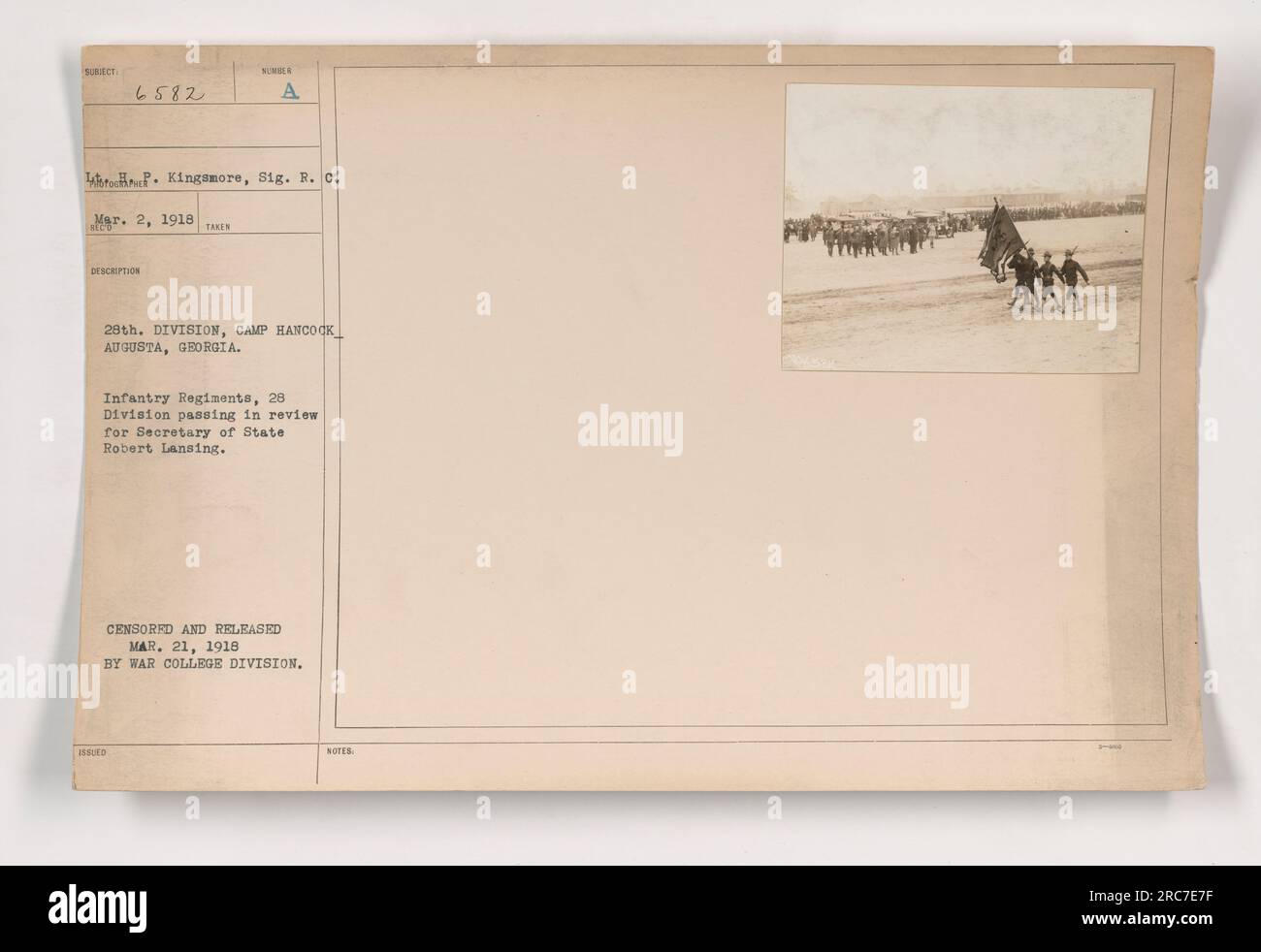 Infantry regiments of the 28th Division passing in review for Secretary of State Robert Lansing during a military event at Camp Hancock in Augusta, Georgia on March 2, 1918. This photograph was censored and released by the War College Division on March 21, 1918. Stock Photo