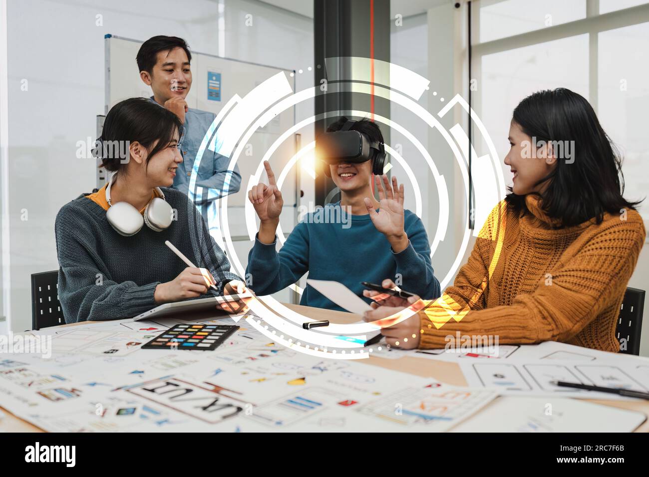 Creative teamwork using high tech headset for virtual reality. Team of ...