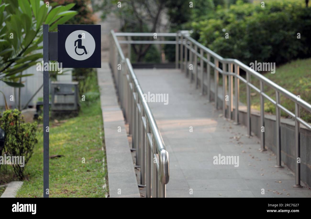 Jakarta, Indonesia - sept 08, 2025 : crossing road sign for persons with disabilities Stock Photo
