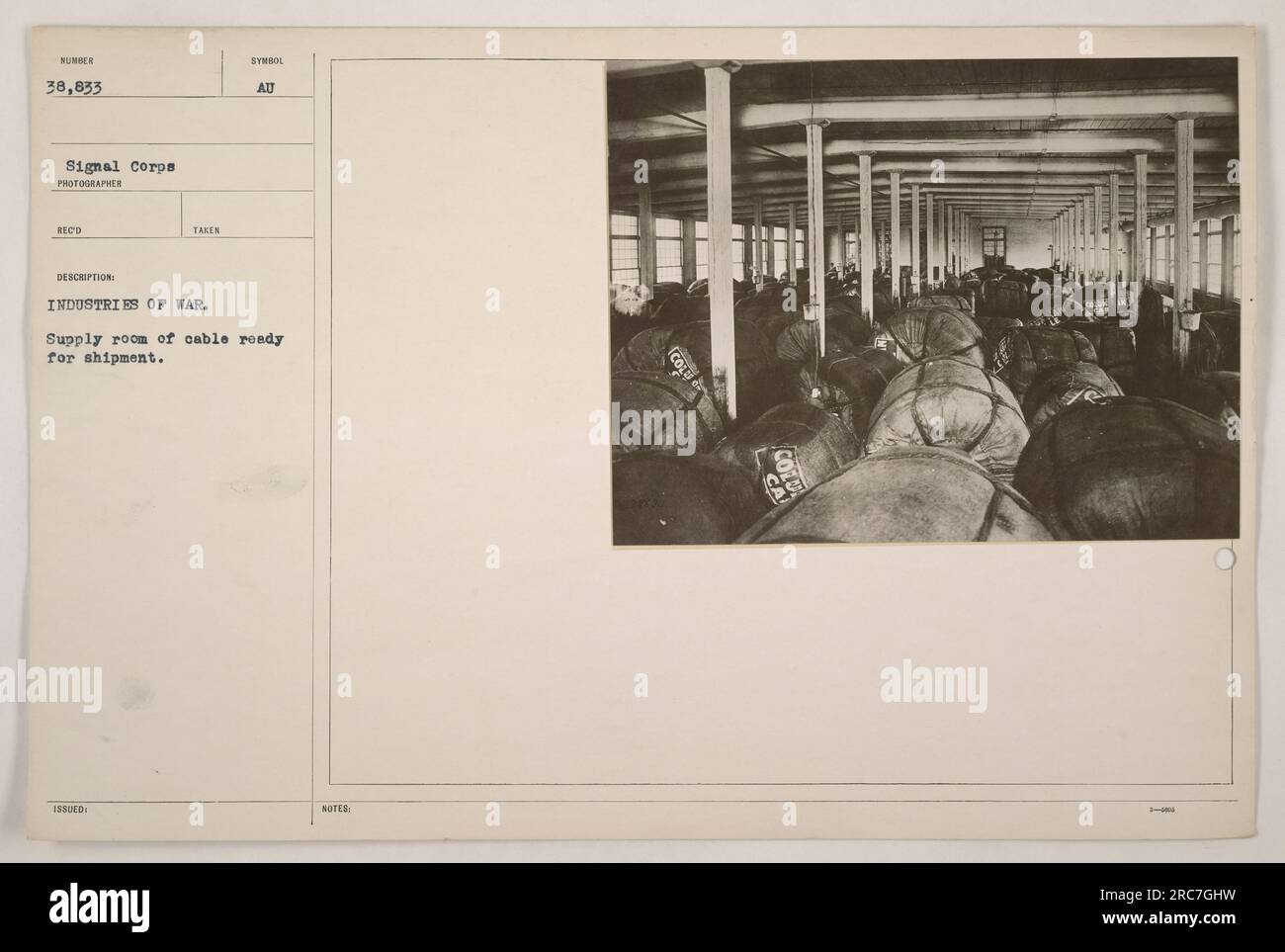 'This photograph showcases an industrial scene during World War One. It shows a supply room filled with ready-to-ship cables, symbolizing the importance of communication in military activities. The image highlights the role of industries in supporting the war effort.' Stock Photo