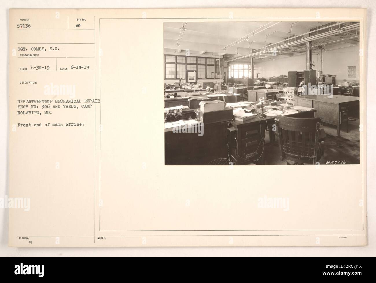 Front view of the main office at the Mechanical Repair Shop No. 306 and Yards located at Camp Holabird, MD. The office bears the number 57136 and was photographed on June 18, 1919, by Sgt. Combs. This image is part of the Photographs of American Military Activities collection. Stock Photo