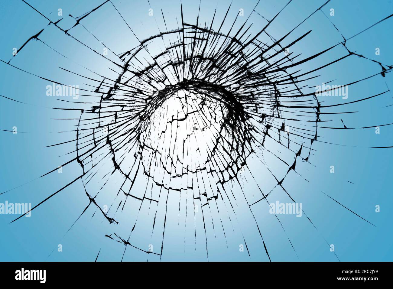 Cracked glass texture, web of broken screen. Cracked effect on blue background for design Stock Photo