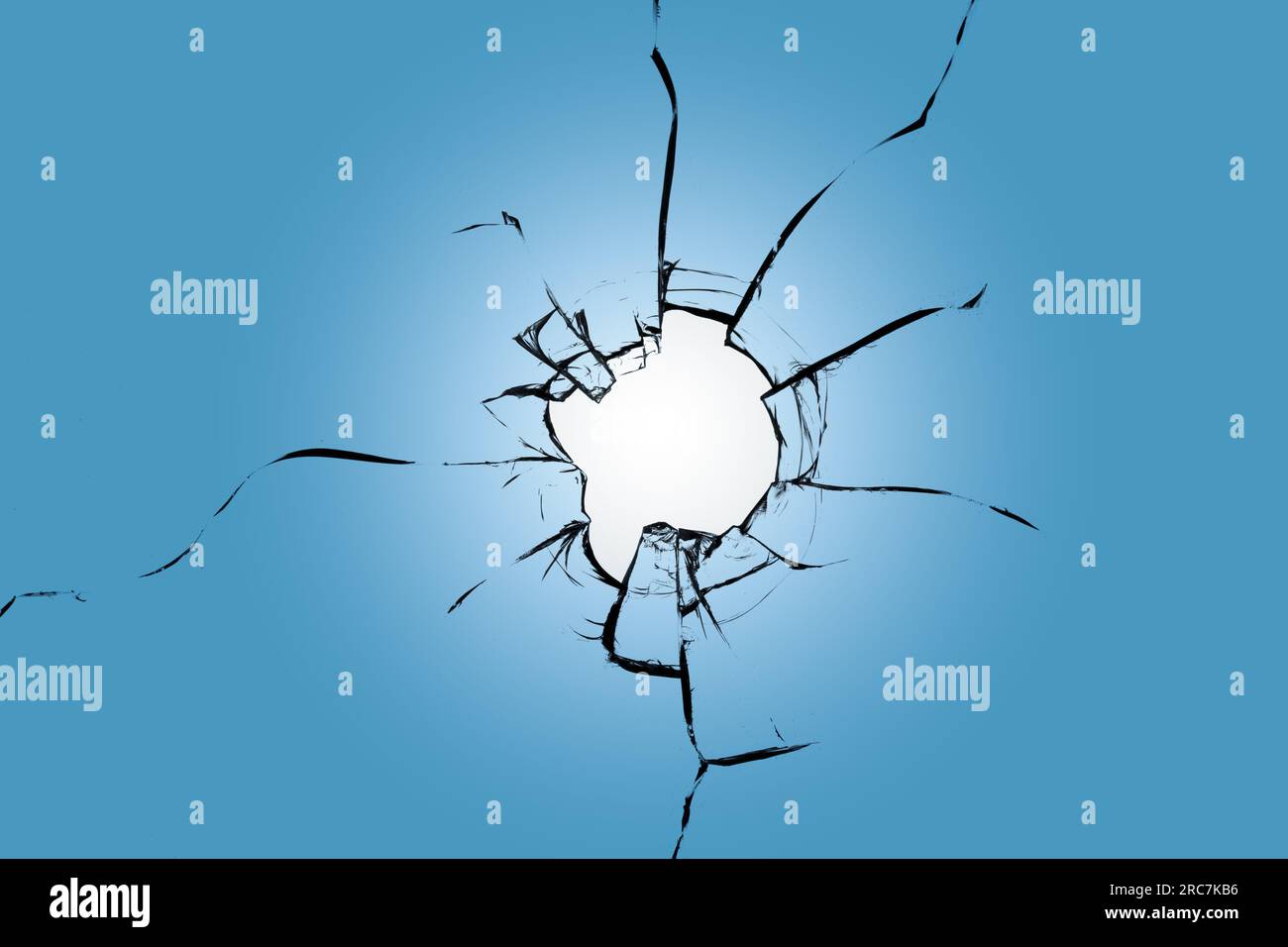A broken window with cracks in the glass. Shatter effect for use in design Stock Photo
