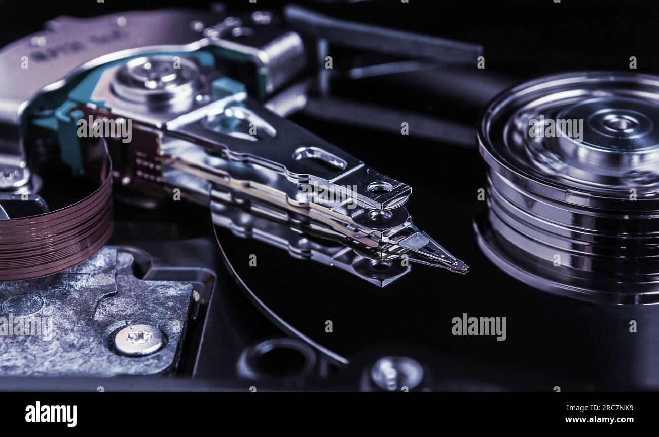 Open hard disk drive with head closeup Stock Photo Alamy