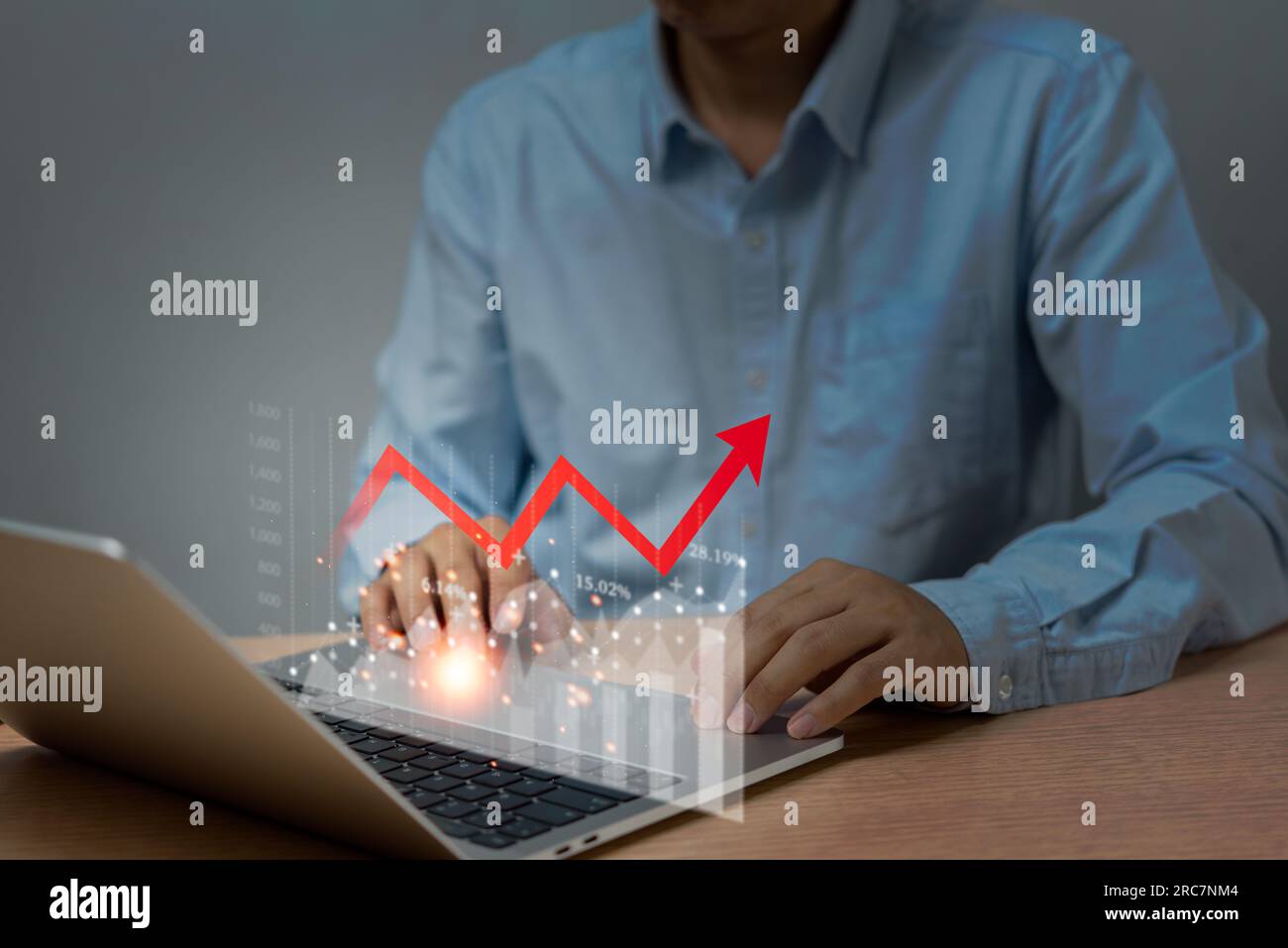 businessman-using-laptop-computer-graph-stock-market-and-chart-marketing-investment-financial-with-arrow-red-interest-rates-and-dividends-income-re-2RC7NM4.jpg