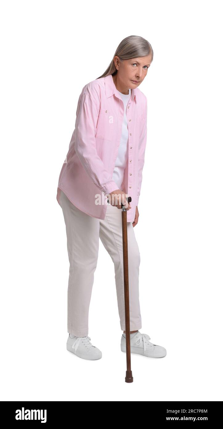 Senior woman with walking cane on white background Stock Photo - Alamy