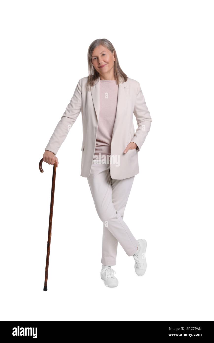 Senior woman with walking cane on white background Stock Photo - Alamy