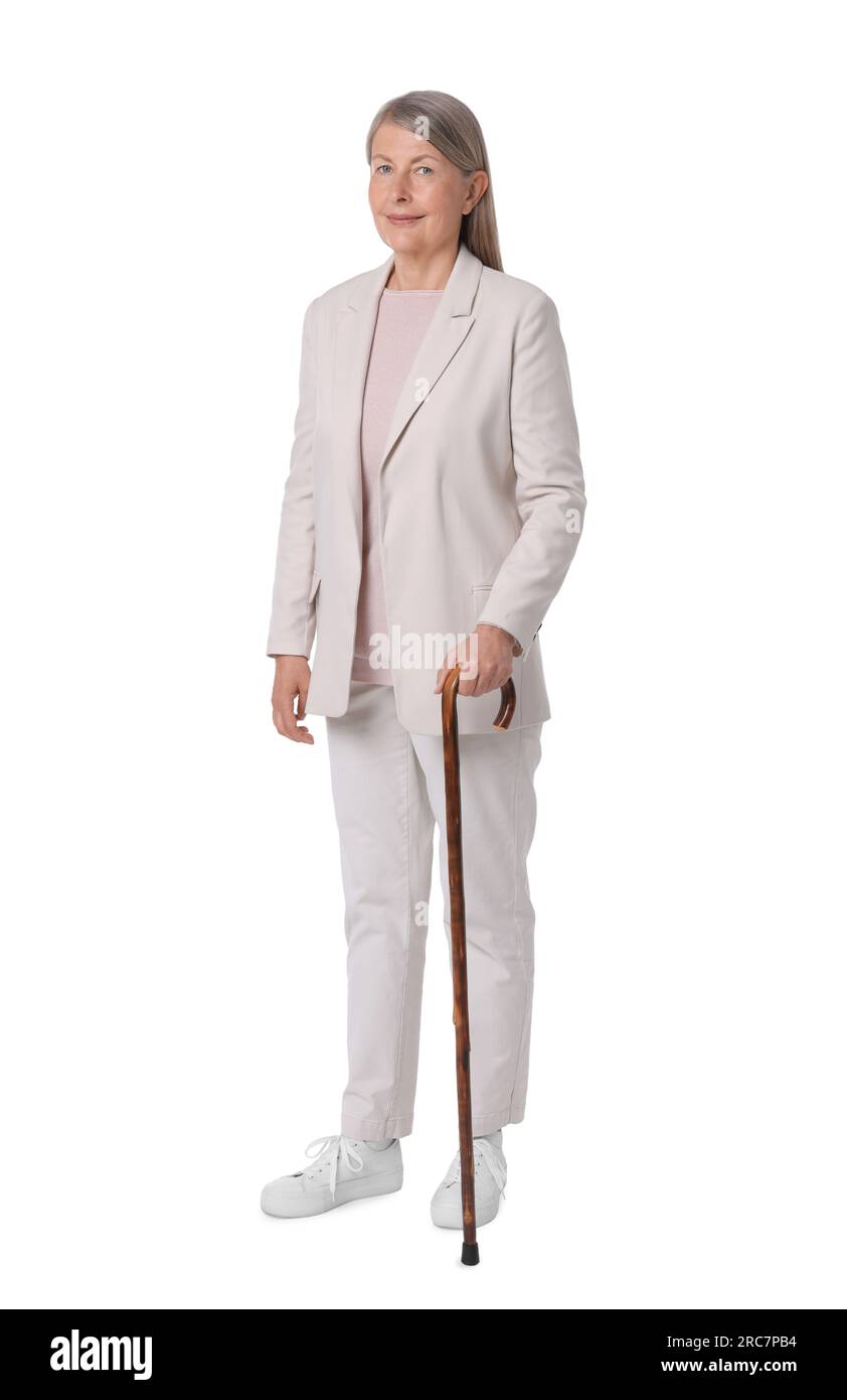 Senior woman with walking cane on white background Stock Photo - Alamy