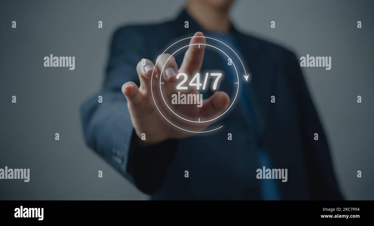 customer service. nonstop service concept. Businessman hand holding virtual 24/7 with clock on hand worldwide nonstop and full-time contact of service Stock Photo