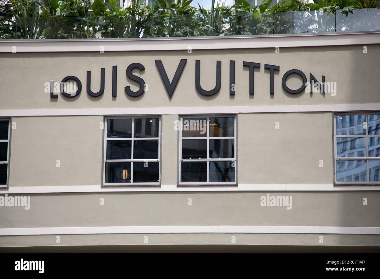 Milan , Italy  - 07 10 2023 : Louis Vuitton logo brand and text sign front facade home shop chain luxe brand handbag and luggage Stock Photo