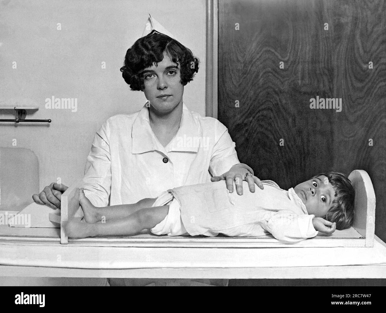 Washington, D.C., 1926. A nurse at the Children's Hospital measures the