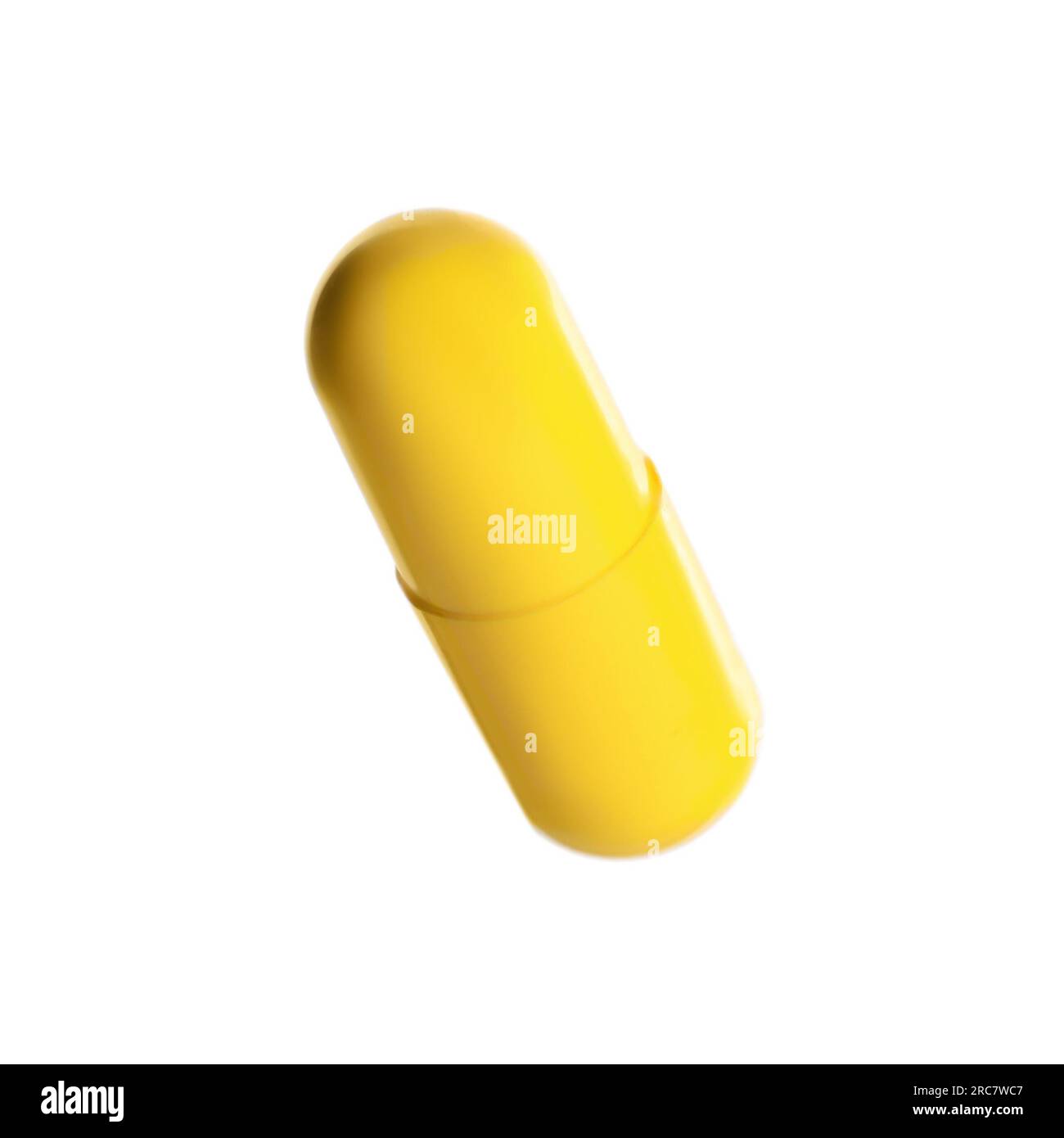 One yellow pill isolated on white. Medicinal treatment Stock Photo Alamy