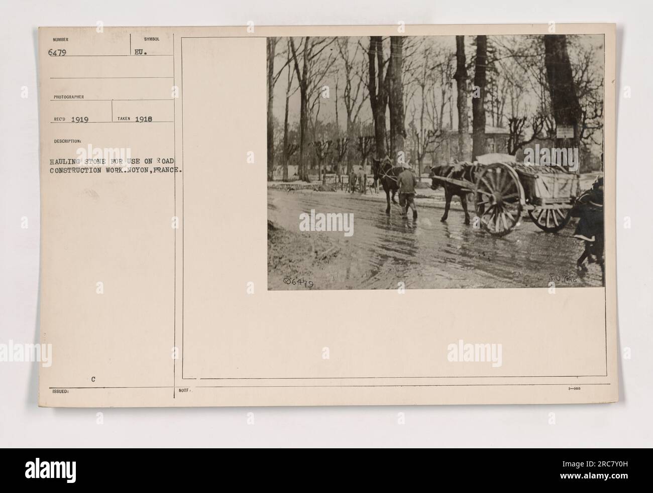 A photo taken in 1919 by a photographer named Hed, with the symbol issued in the European Union, shows American military personnel hauling stones for road construction work in Noyon, France. The image depicts the efforts of the soldiers during World War One. Stock Photo